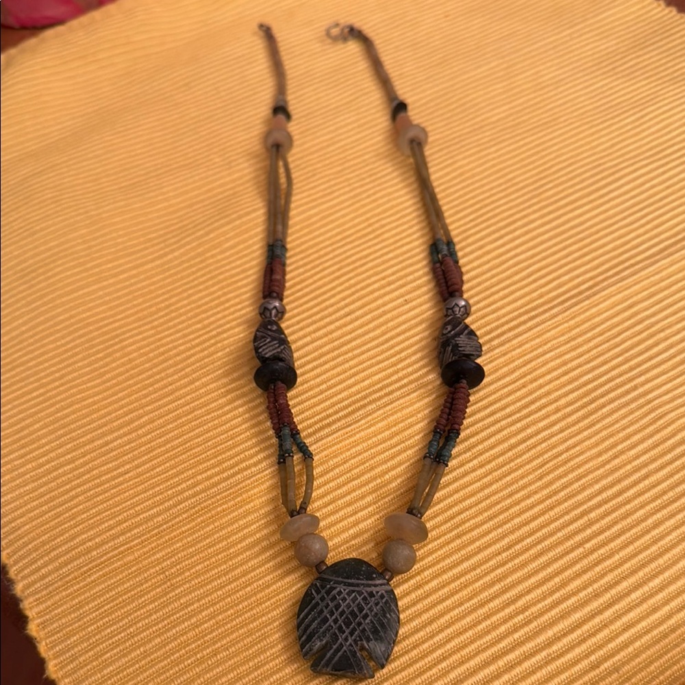 Tribal Green and Brown Necklace with Intricate Pendant. Fish design on pendants